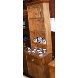 An antique narrow pine dresser with drawer and cupboards below