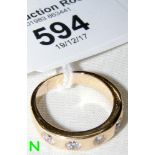 A diamond five stone ring in 14ct gold setting