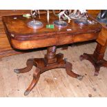 A 19th century fold-over tea table with cross banded top and shaped column support