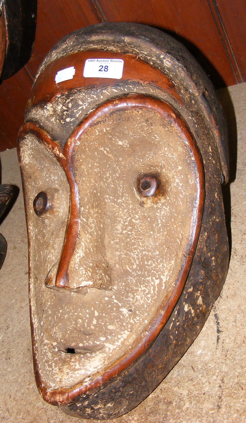 An old carved wooden African tribal mask with painted face - 44cm