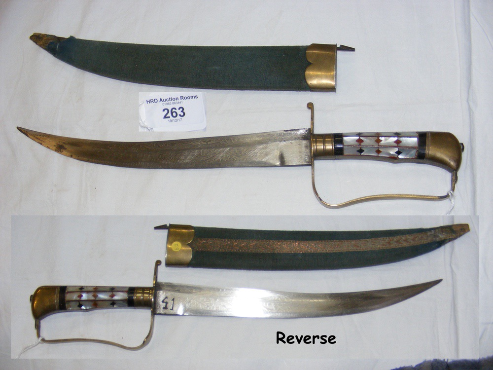 A Middle Eastern dagger with engraved blade and Mother of Pearl handle - 35cm long