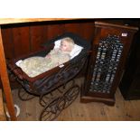 Ceramic doll in pram, together with antique style CD cabinet containing numerous CD's