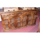 A rustic continental style sideboard with drawers and cupboards below