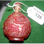 A red overlay (Peking glass) Chinese snuff bottle with glass top and ivory spoon - 7.5cm