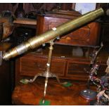 An 80cm long antique brass range finder telescope on tripod