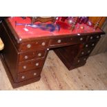 Antique pedestal desk with nine drawers to the front