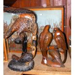 A carved wooden bird ornament and one other