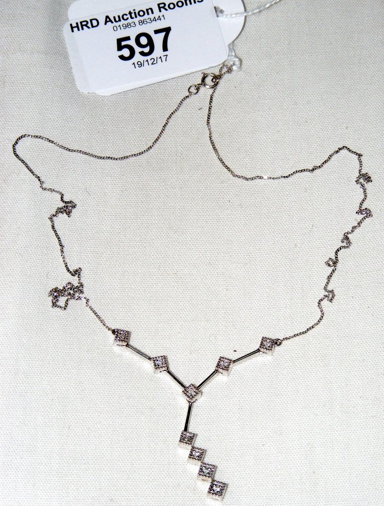 A 9ct white gold diamond pendant on chain