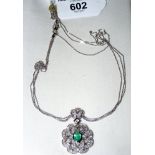 An emerald and diamond mounted pendant in 18ct white gold setting with chain