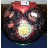 A Moorcroft pottery vase with fruit and leaf design - 18cm high - with mark to base