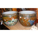 A pair of 37cm diameter oriental style jardinieres with floral and bird decoration