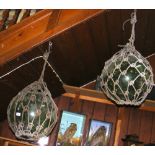 Pair of large green glass fishing floats