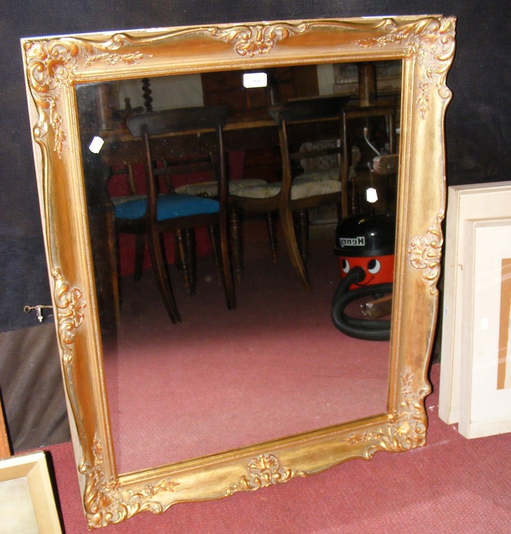 Decoratively gilt framed wall mirror - 91cm x 75cm