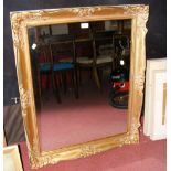 Decoratively gilt framed wall mirror - 91cm x 75cm