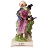 A early 19th Century Ralph Wood type pearlware polychrome FIGURE of ELIJAH modelled in a seated pose