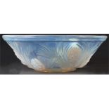 A late 19th Century Lalique type Vaseline Glass BOWL with relief moulded flower head and leaf