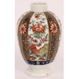 A First Period Worcester polychrome TEA CADDY of footed fluted ovoid form decorated with alternate