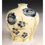 A Moorcroft Style cream glazed squat bulbous VASE with narrow neck decorated all round with corn