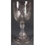 A 19th Century Cut Glass GOBLET with star-cut base, facetted stem and fan cut lower bowl beneath