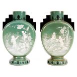 A pair of late 19th Century Green Opaque Glass MOON FLASKS with circular bases and black stepped