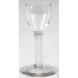 AN 18TH CENTURY WINE GLASS with ogee bowl and opaque multi-spiral air twist stem, on a flat foot