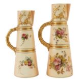 TWO ROYAL WORCESTER GRADUATED GILT-EDGED TAPERING BLUSHED IVORY CLARET JUGS with ringed bodies and