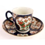 A FIRST PERIOD BLUE SCALE POLYCHROME WORCESTER CABINET CUP AND SAUCER with finely painted scrolled