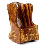 A 19th CENTURY SLIPWARE MINIATURE LAMBING CHAIR dated 1871 19cm high