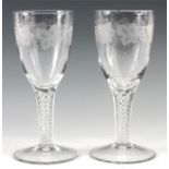 A LARGE PAIR OF 19TH CENTURY GOBLETS the bowls engraved with bands of fruiting in vines, multi-