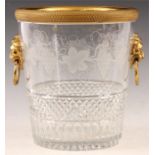 A REGENCY STYLE CUT GLASS AND ORMOLU MOUNTED CHAMPAGNE BUCKET the tapering body with star work base,