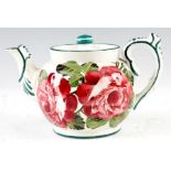 A LATE 19TH CENTURY SMALL WEMYSS TEAPOT of bullet-shape, painted in the pink roses pattern 10cm high