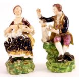 A PAIR OF 19TH CENTURY BLOOR DERBY SEATED FIGURES WITH PUG DOGS each dressed in colourful