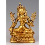 AN EARLY 17TH/18TH CENTURY GILT BRONZE TIBETAN BRONZE OF A SEATED BUDA 16.5cm high.