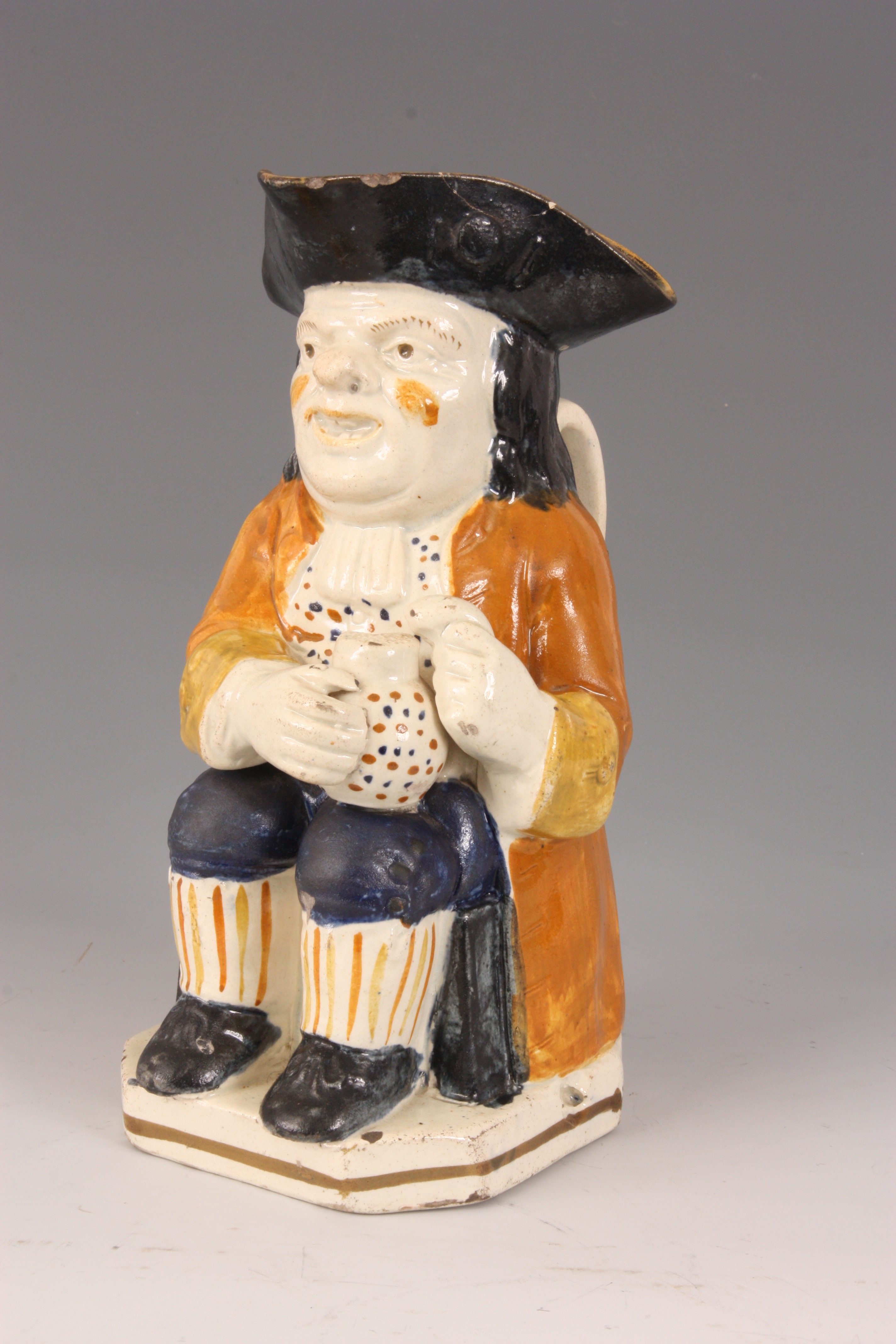 A GEORGE III STAFFORDSHIRE TOBY JUG the seated man holding a jug of ale in ochre hat with mustard - Image 9 of 10