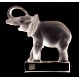 A LALIQUE FROSTED GLASS PAPER WEIGHT MODELLED AS AN ELEPHANT, signed Lalique (R) France 15cm wide