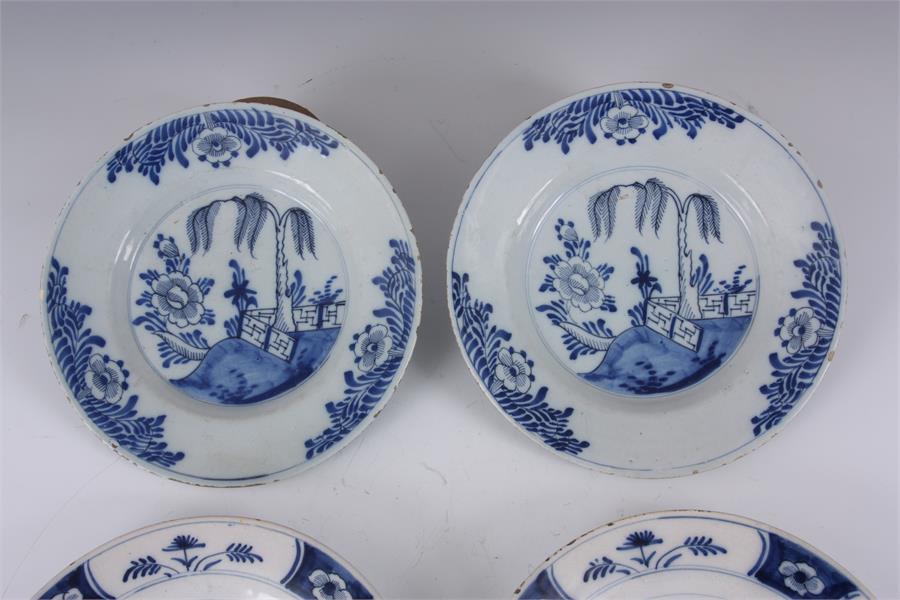 TWO PAIRS OF 18TH CENTURY DUTCH DELFT PLATES with tree lined landscape centres and floral panelled - Image 4 of 6