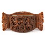 A 19TH CENTURY COQUILLA NUT SNUFF BOX finely carved depicting religious scenes and a coat of arms to