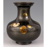 A BULBOUS CHINESE BRASS VASE with grey enamel mottled lustre finish and relief work leaves to the