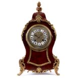 A LATE 19TH CENTURY FRENCH ORMOLU MOUNTED TOIRTOISESHELL BALLOON SHAPED MANTEL CLOCK with a brass