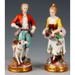 A PAIR OF LATE 19TH CENTURY SITZENDORF FIGURES OF A YOUNG LADY AND GENTLEMAN collecting flowers