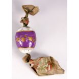 A LATE 19TH CENTURY PORCELAIN RUSSIAN EASTER EGG on a purple and white ground with gilt leaf work