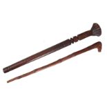 AN ANTIQUE AFRICAN HARDWOOD FIGHTING CLUB with turned shaft and notched head 79cm overall - along