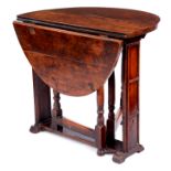 AN UNUSUAL EARLY 18TH CENTURY FRUITWOOD SMALL FALL LEAF GATELEG TABLE OF FINE COLOUR AND PATINA of