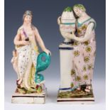 TWO EARLY 19TH CENTURY STAFFORDSHIRE FIGURES with polychrome colours depicting a lady mourning and