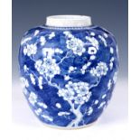 A LARGE ANTIQUE CHINESE GINGER JAR decorated with flowering cherry blossom, four character marks