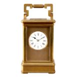 A LATE 19TH CENTURY FRENCH BRASS STRIKING CARRIAGE CLOCK having canted corners on a plinth base. The