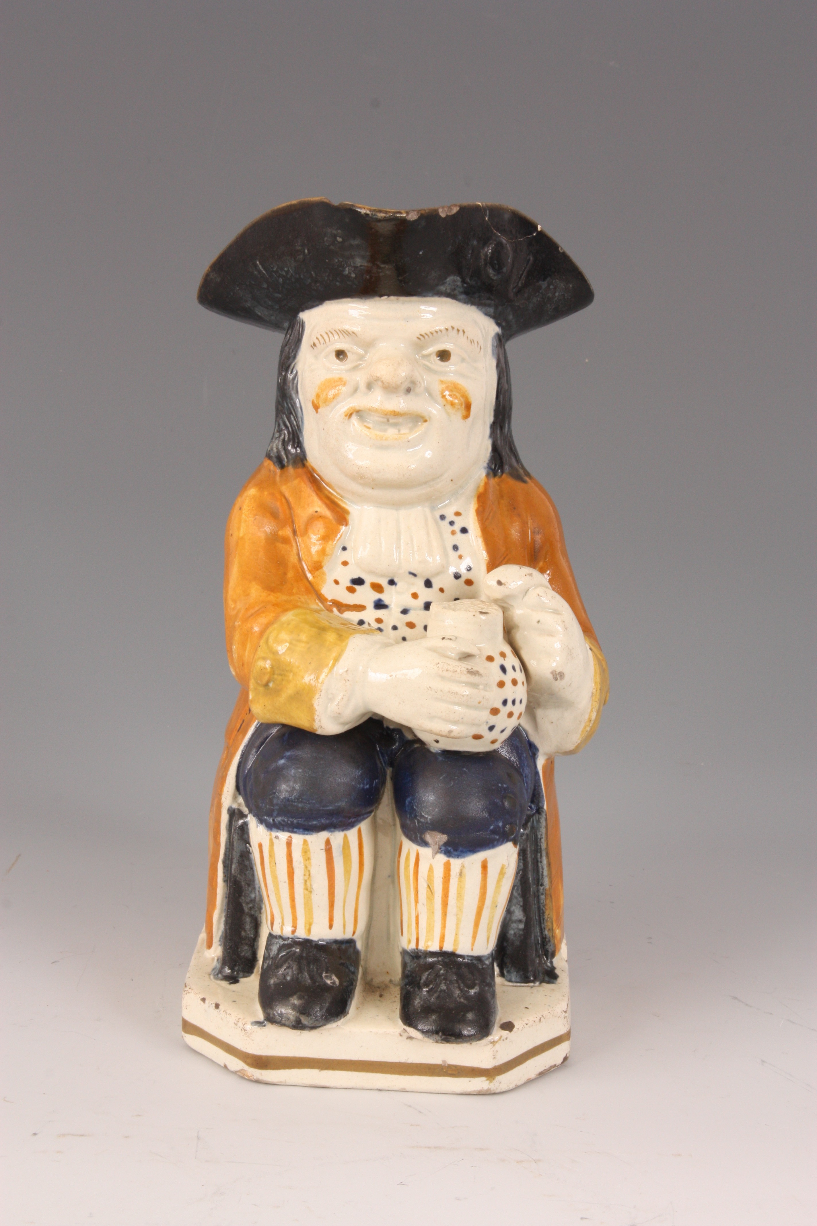 A GEORGE III STAFFORDSHIRE TOBY JUG the seated man holding a jug of ale in ochre hat with mustard - Image 8 of 10