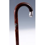 A LATE 19TH CENTURY SILVER INLAID ROSEWOOD WALKING STICK with crook handle, flower head