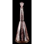 R LALIQUE, A SIX FIGURINE PINK STAINED GLASS DECANTER of angled form and decorated with carved