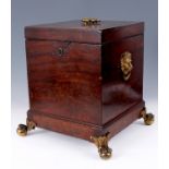 A GEORGE III MAHOGANY SQUARE CELLARETTE with divided interior, brass handle fittings and unusual
